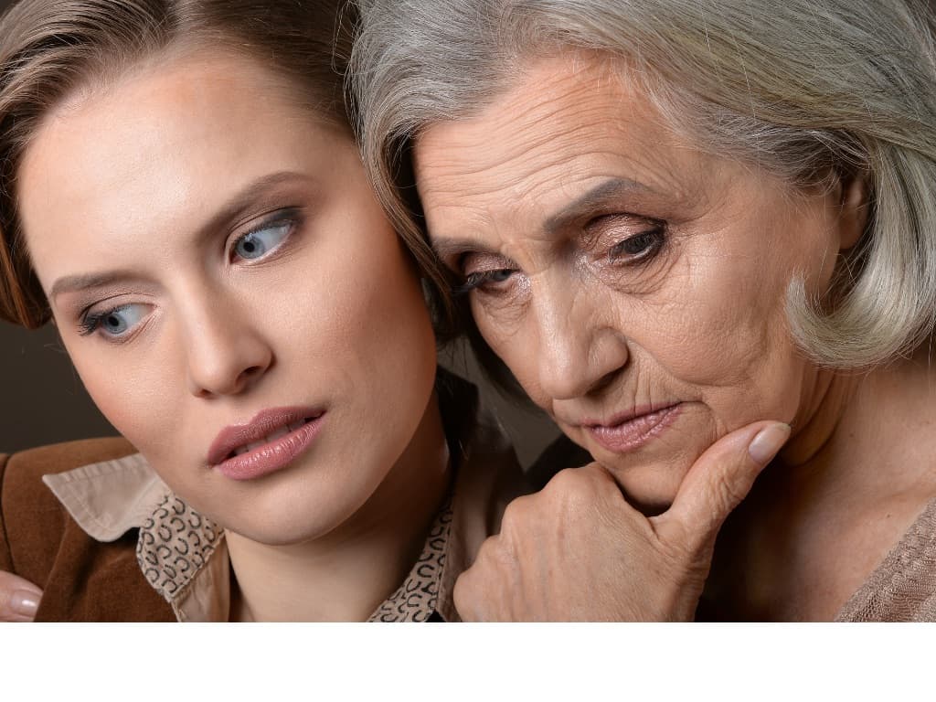 Two women, one is younger and the other is older and showing signs of aging such as wrinkles and skin sagging